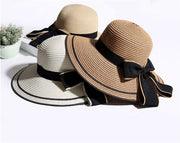 Foldable straw sun hats with wide brim and big black bow for women, beach and summer wear