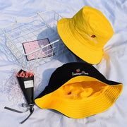 Yellow and black reversible bucket hat fisherman hats with summer embroidery on white background
