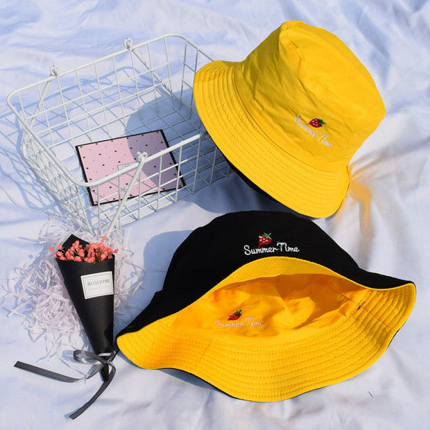 Yellow and black reversible bucket hat fisherman hats with summer embroidery on white background