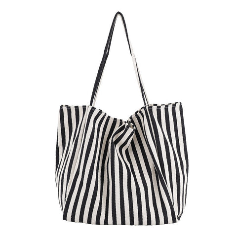 Black and white striped canvas shoulder bag for women, high capacity casual shopping tote.