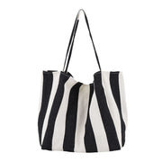 Black and white striped high capacity canvas shoulder bag for women, casual shopper tote.