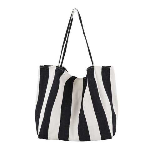 Black and white striped high capacity canvas shoulder bag for women, casual shopper tote.
