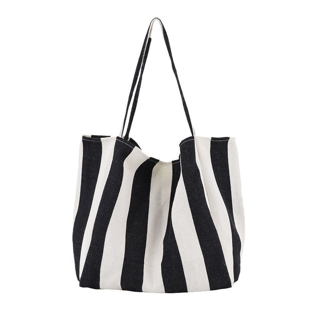 Black and white striped high capacity canvas shoulder bag for women, casual shopper tote.