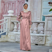 Elegant women's long satin waist tie dress in pink with long sleeves and high waist design