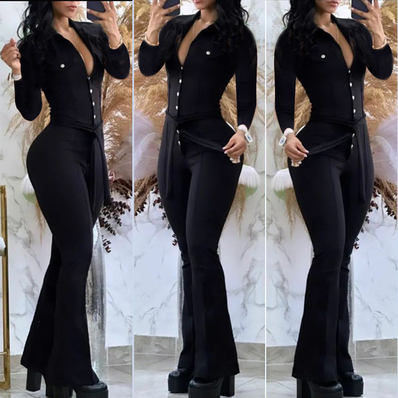 Woman wearing black casual flared pants jumpsuit with button-down front and belt, posing indoors