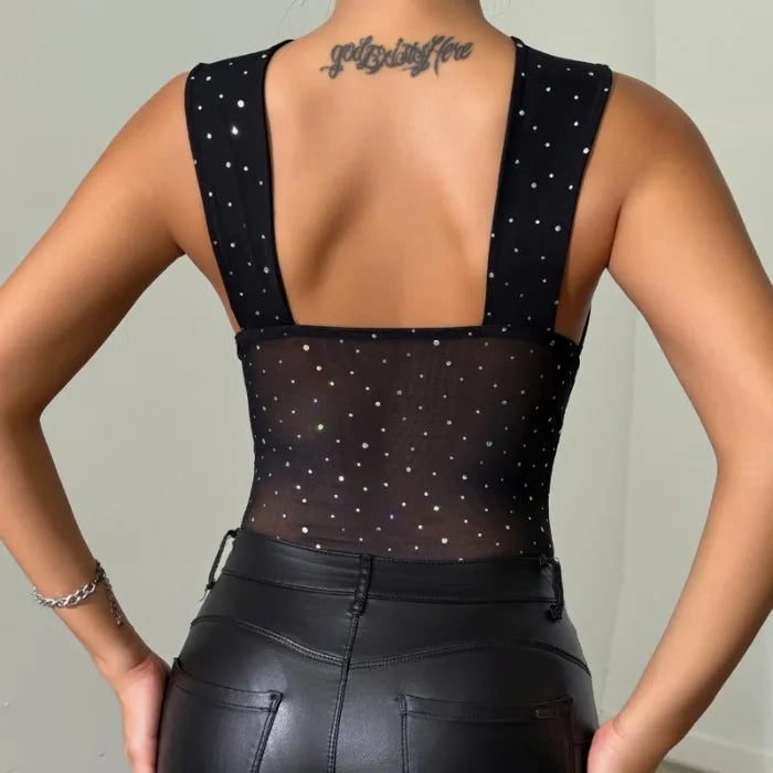 Back view of women's black sequin sheer jumpsuit with thick straps and backless design