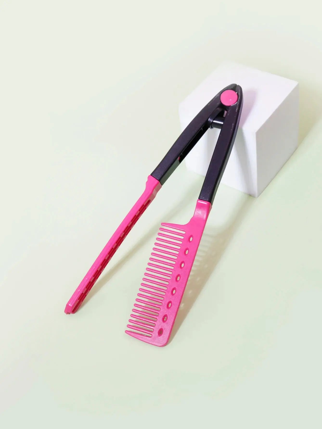pink and black plastic flat comb straight hair styling tool with V-shaped design