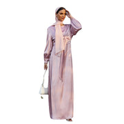 Elegant women's long satin dress in soft pink with high waist tie and long sleeves