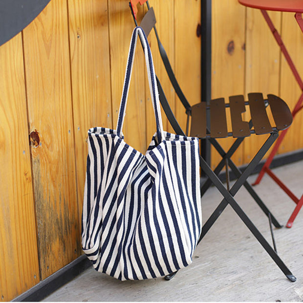 Striped canvas shoulder bag for women with high capacity and casual shopper tote design