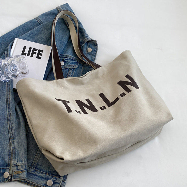 Letter printed large capacity canvas tote bag in khaki, shoulder bag for women with zipper and phone pocket, stylish college commuting handbag